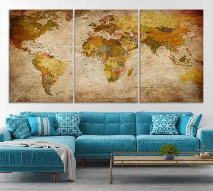 The Old Antique World Map Wall Art Canvas Print, featuring a three-panel vintage design and crafted with museum-quality canvas and UV-protective coating, hangs elegantly against a dark wall.