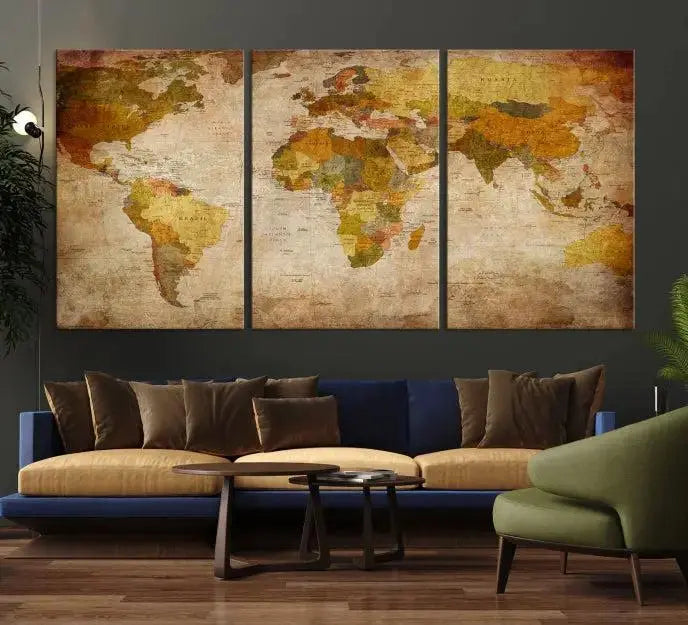 The Old Antique World Map Wall Art Canvas Print, featuring a three-panel vintage design and crafted with museum-quality canvas and UV-protective coating, hangs elegantly against a dark wall.