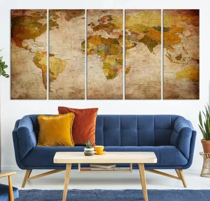 The Old Antique World Map Wall Art Canvas Print, featuring a three-panel vintage design and crafted with museum-quality canvas and UV-protective coating, hangs elegantly against a dark wall.