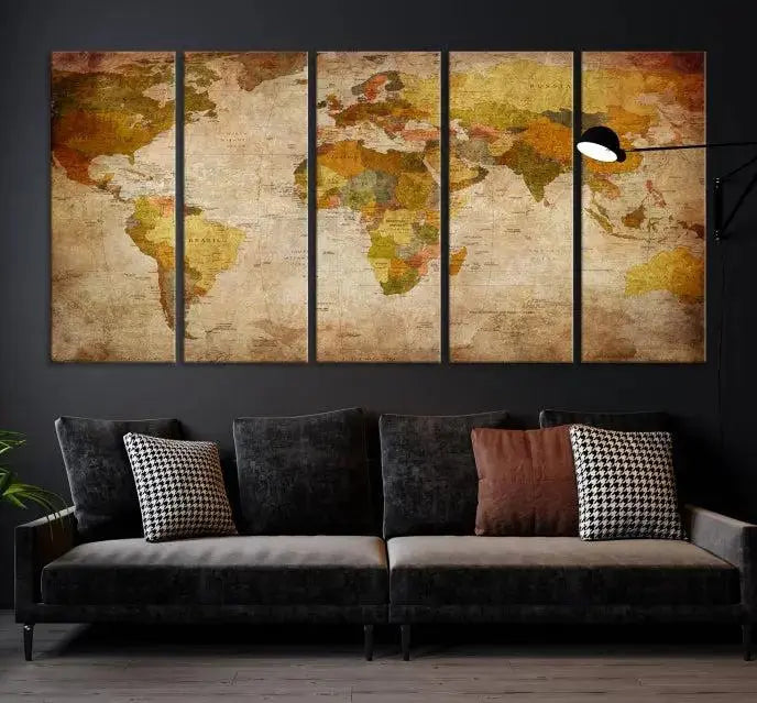 The Old Antique World Map Wall Art Canvas Print, featuring a three-panel vintage design and crafted with museum-quality canvas and UV-protective coating, hangs elegantly against a dark wall.