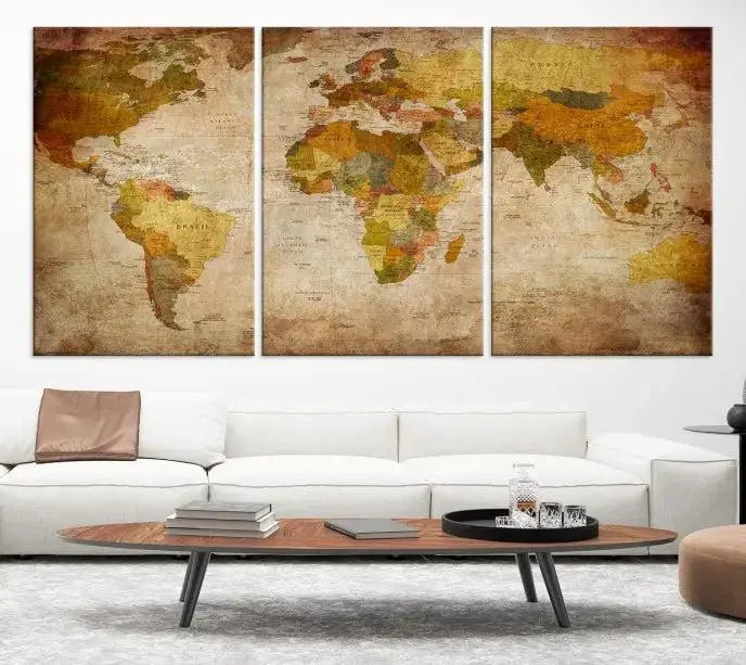 The Old Antique World Map Wall Art Canvas Print, featuring a three-panel vintage design and crafted with museum-quality canvas and UV-protective coating, hangs elegantly against a dark wall.