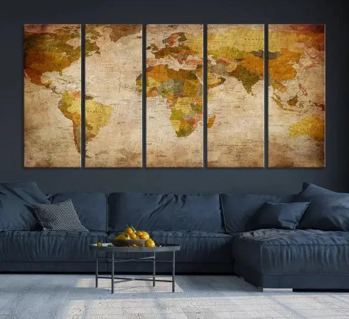 The Old Antique World Map Wall Art Canvas Print, featuring a three-panel vintage design and crafted with museum-quality canvas and UV-protective coating, hangs elegantly against a dark wall.