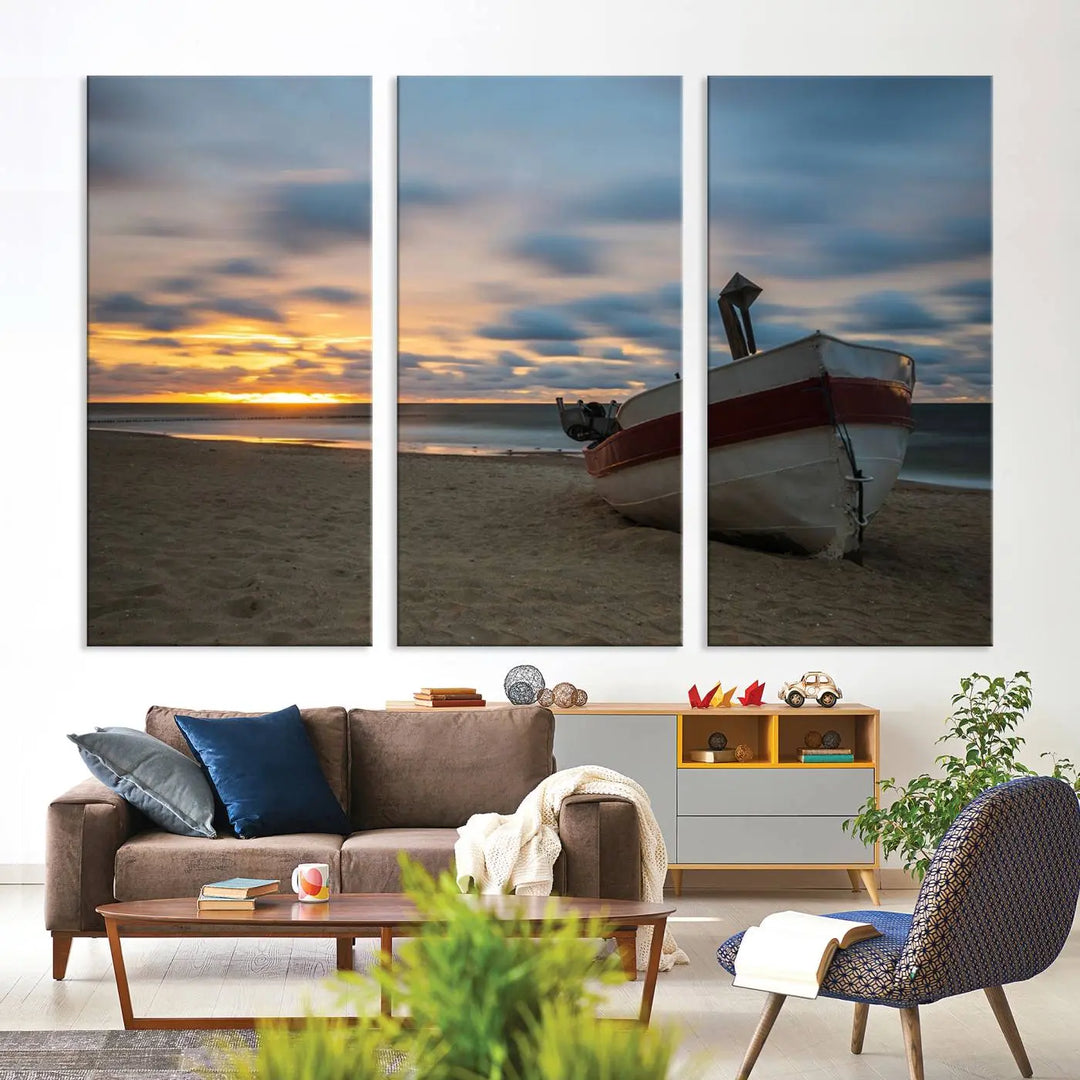 This living room showcases the "Old Boat On The Beach Sunset Coastal Ocean Wall Art Canvas," a three-panel artwork crafted on museum-quality canvas. This ready-to-hang piece is finished with a UV-protective coating for enduring beauty.