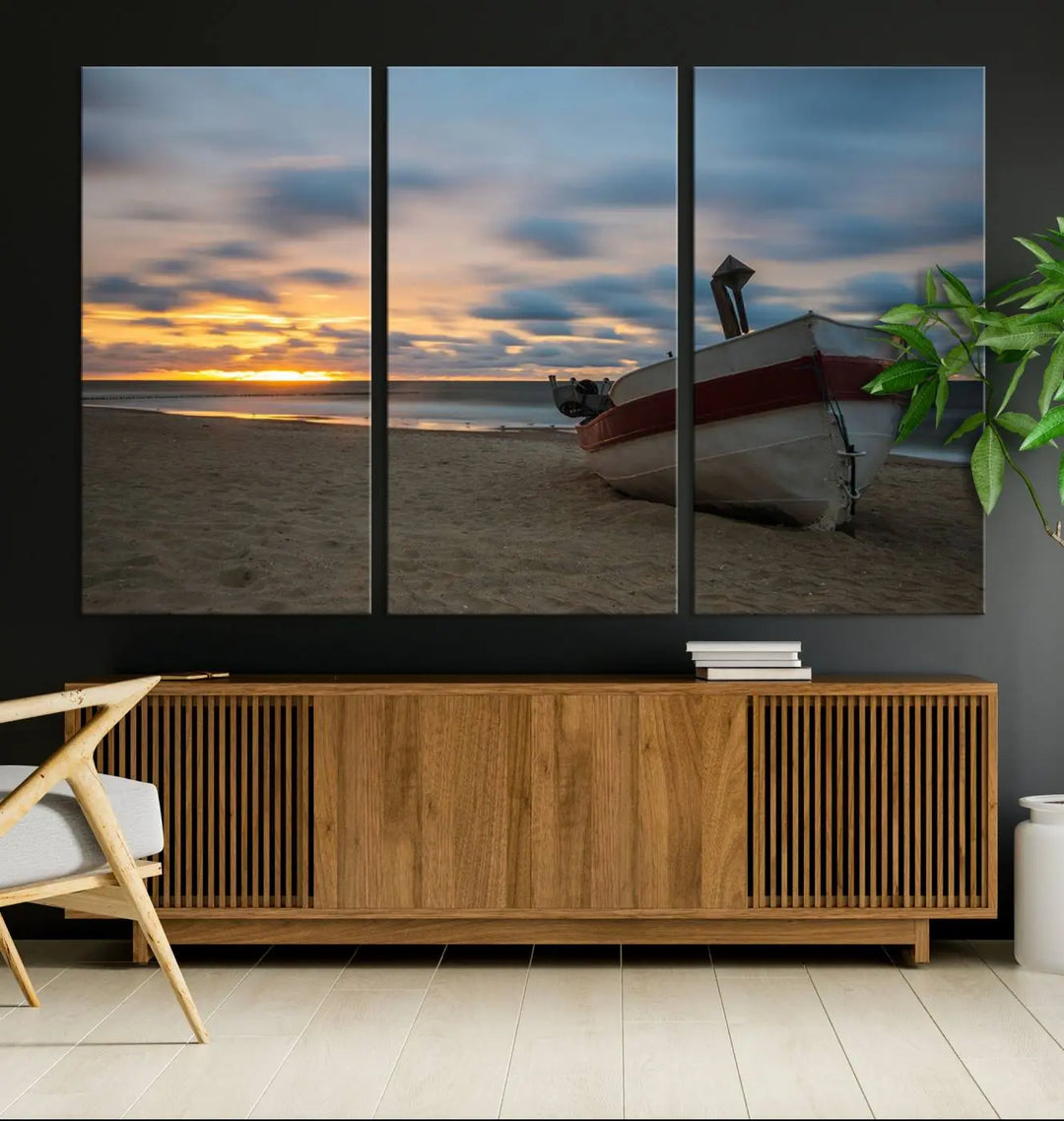 This living room showcases the "Old Boat On The Beach Sunset Coastal Ocean Wall Art Canvas," a three-panel artwork crafted on museum-quality canvas. This ready-to-hang piece is finished with a UV-protective coating for enduring beauty.