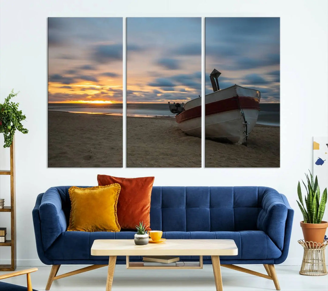 This living room showcases the "Old Boat On The Beach Sunset Coastal Ocean Wall Art Canvas," a three-panel artwork crafted on museum-quality canvas. This ready-to-hang piece is finished with a UV-protective coating for enduring beauty.