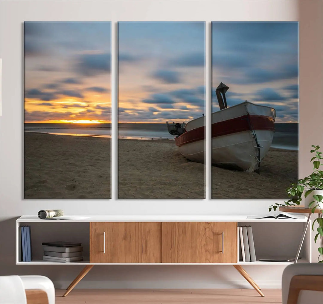 This living room showcases the "Old Boat On The Beach Sunset Coastal Ocean Wall Art Canvas," a three-panel artwork crafted on museum-quality canvas. This ready-to-hang piece is finished with a UV-protective coating for enduring beauty.