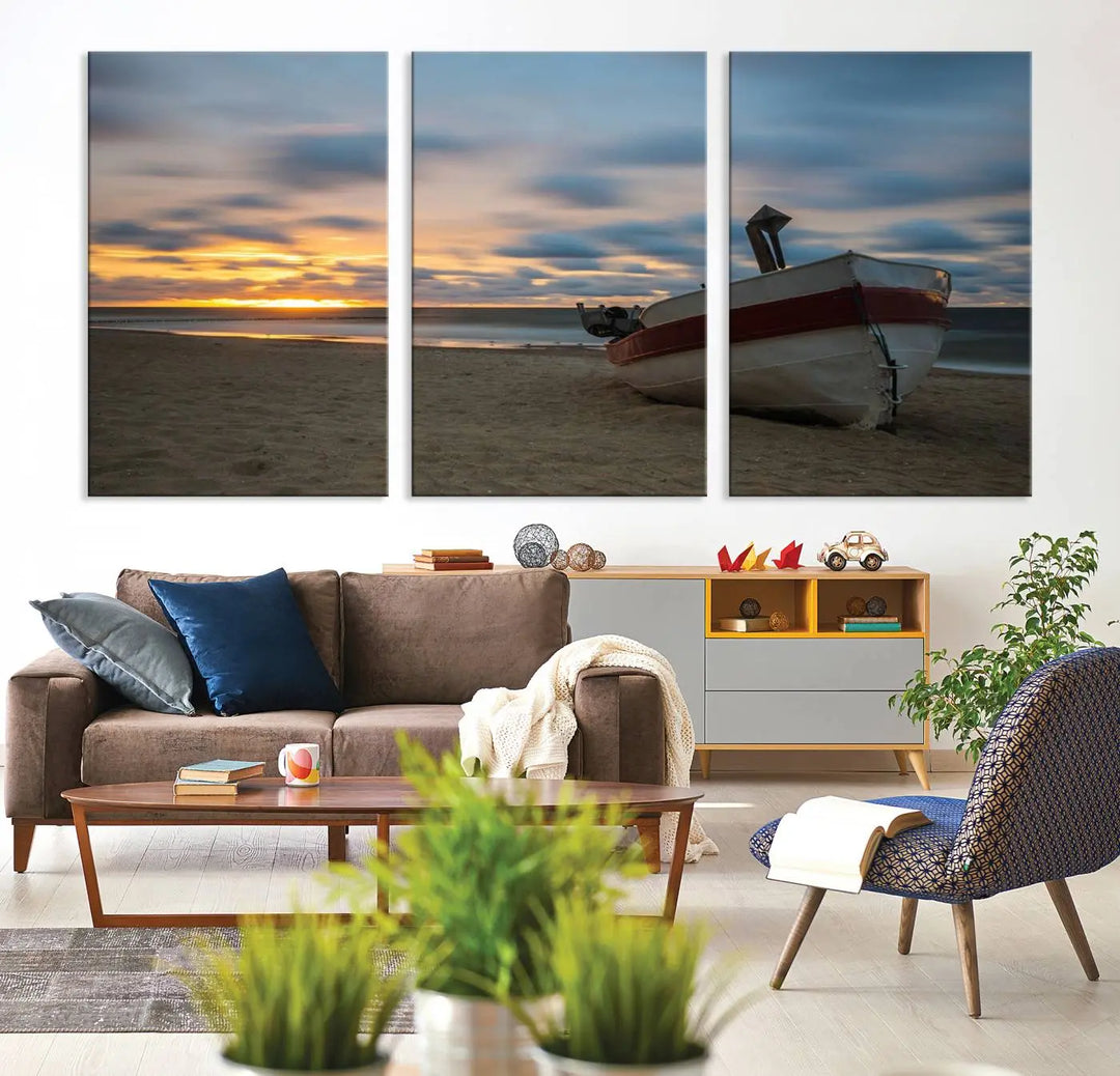 This living room showcases the "Old Boat On The Beach Sunset Coastal Ocean Wall Art Canvas," a three-panel artwork crafted on museum-quality canvas. This ready-to-hang piece is finished with a UV-protective coating for enduring beauty.