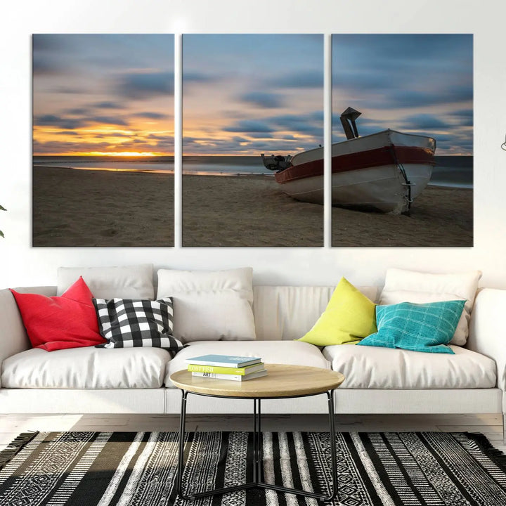 This living room showcases the "Old Boat On The Beach Sunset Coastal Ocean Wall Art Canvas," a three-panel artwork crafted on museum-quality canvas. This ready-to-hang piece is finished with a UV-protective coating for enduring beauty.