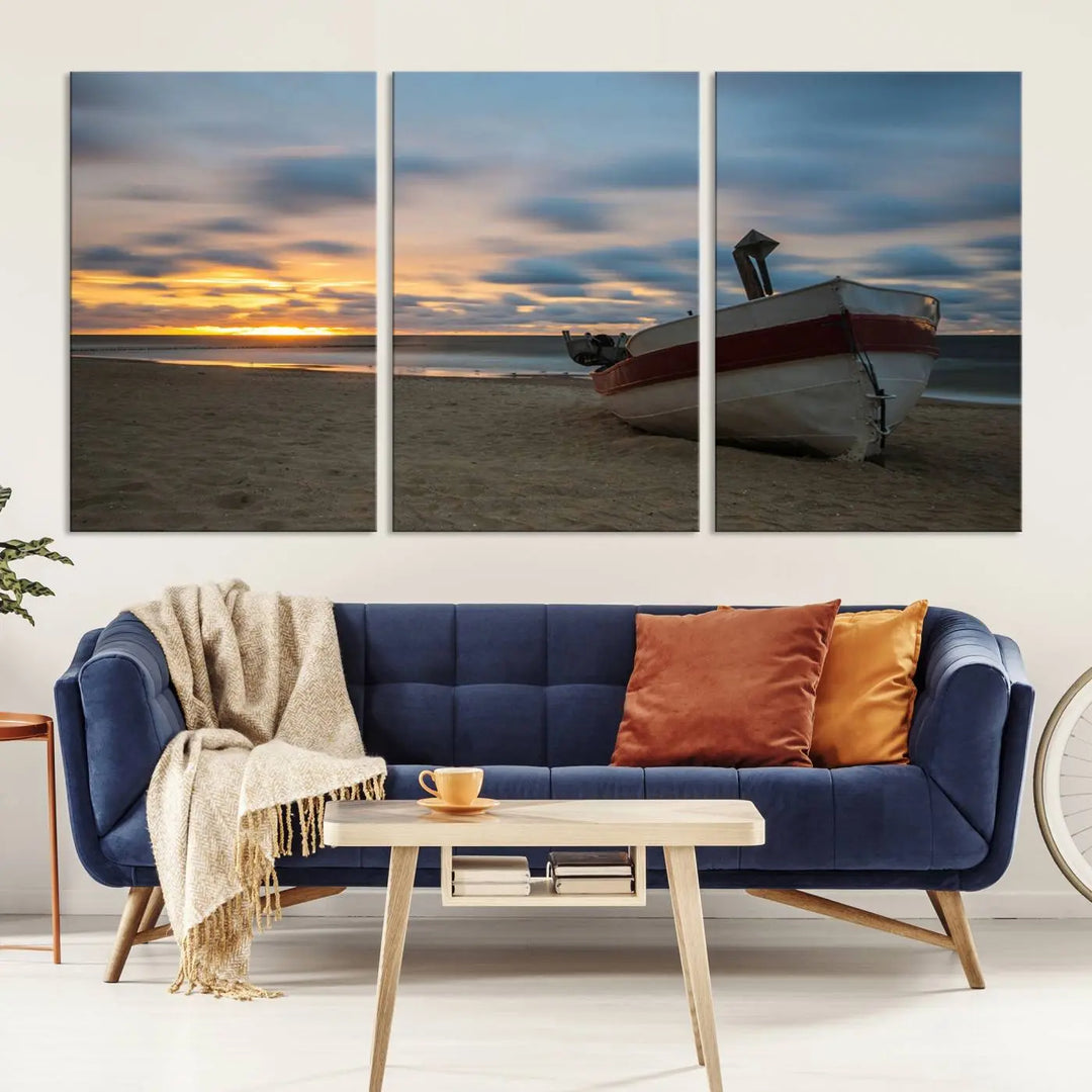 This living room showcases the "Old Boat On The Beach Sunset Coastal Ocean Wall Art Canvas," a three-panel artwork crafted on museum-quality canvas. This ready-to-hang piece is finished with a UV-protective coating for enduring beauty.