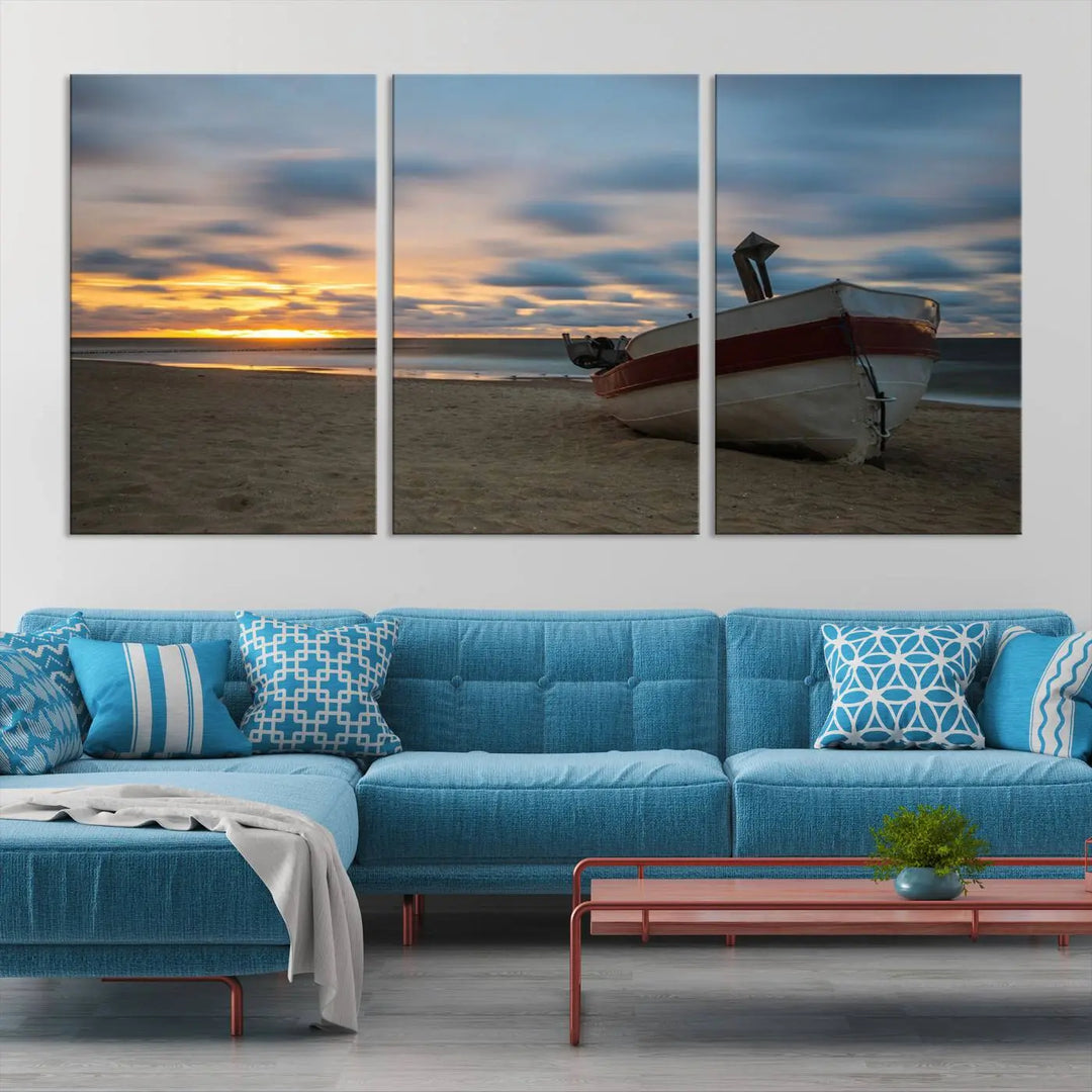 This living room showcases the "Old Boat On The Beach Sunset Coastal Ocean Wall Art Canvas," a three-panel artwork crafted on museum-quality canvas. This ready-to-hang piece is finished with a UV-protective coating for enduring beauty.