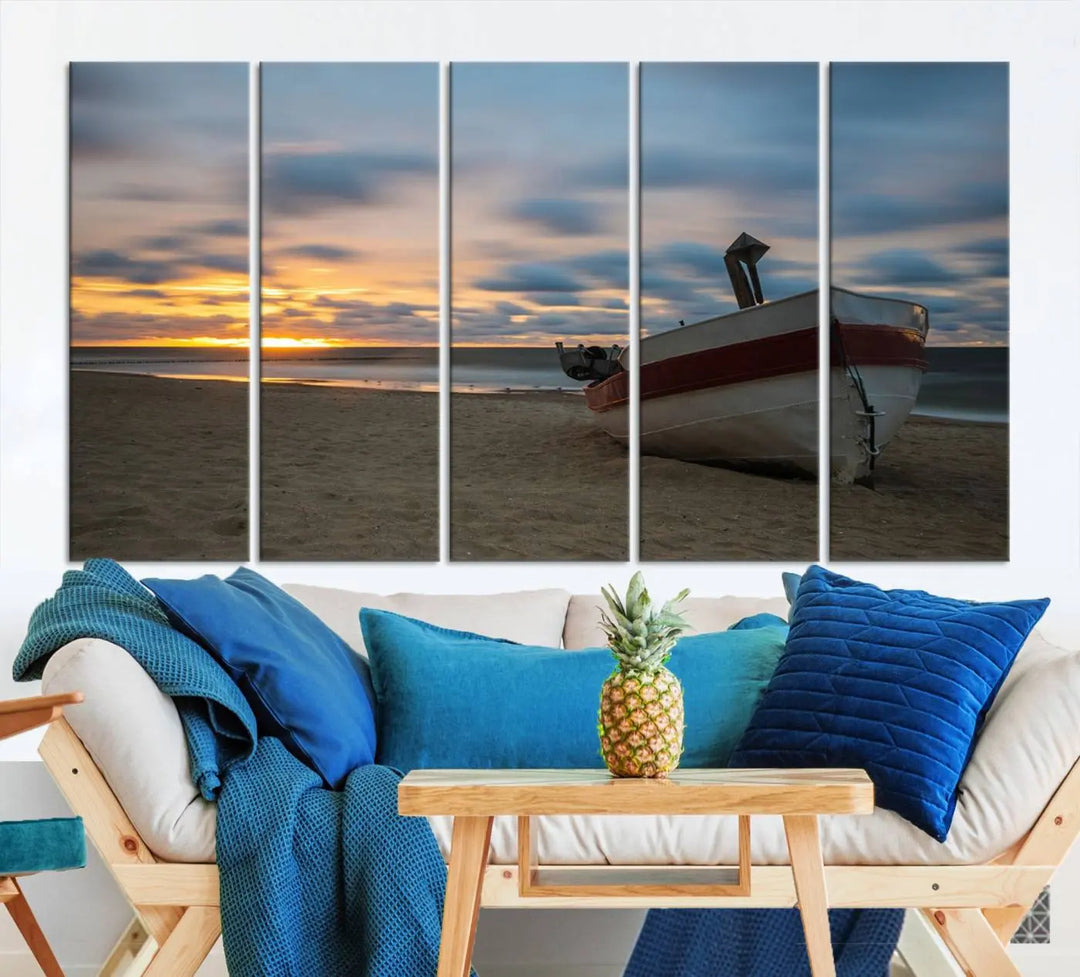 This living room showcases the "Old Boat On The Beach Sunset Coastal Ocean Wall Art Canvas," a three-panel artwork crafted on museum-quality canvas. This ready-to-hang piece is finished with a UV-protective coating for enduring beauty.