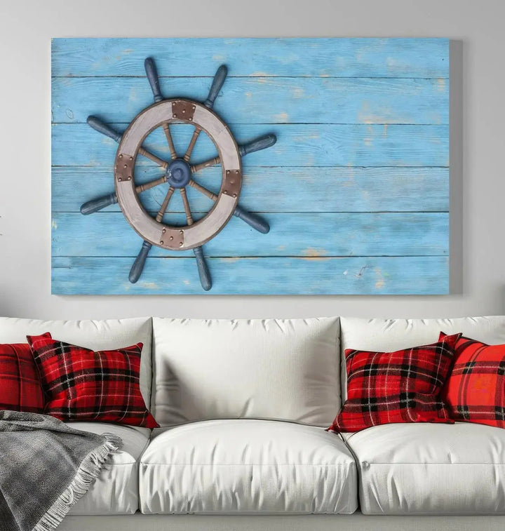 The Old Ship Steering Wheel Nautical Wall Art, printed on museum-quality canvas with a UV-protective coating, is displayed prominently on the wall.