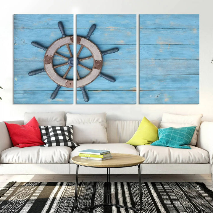 The Old Ship Steering Wheel Nautical Wall Art, printed on museum-quality canvas with a UV-protective coating, is displayed prominently on the wall.