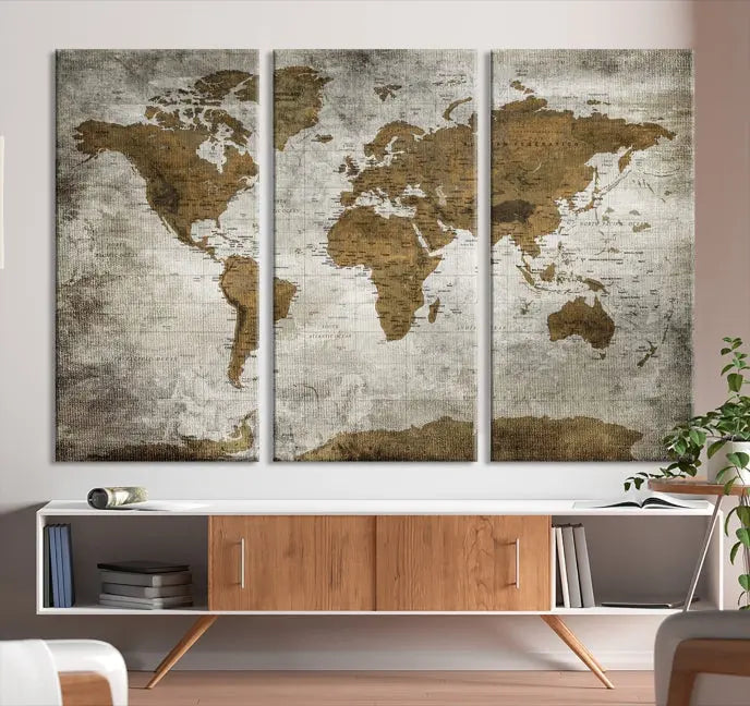 The elegant Old Style World Map Wall Art Canvas Print, presented as a stunning triptych, enhances the living room's ambiance. Crafted on museum-quality canvas and protected by a UV coating, it's ready to hang and stands as a captivating piece in the room.