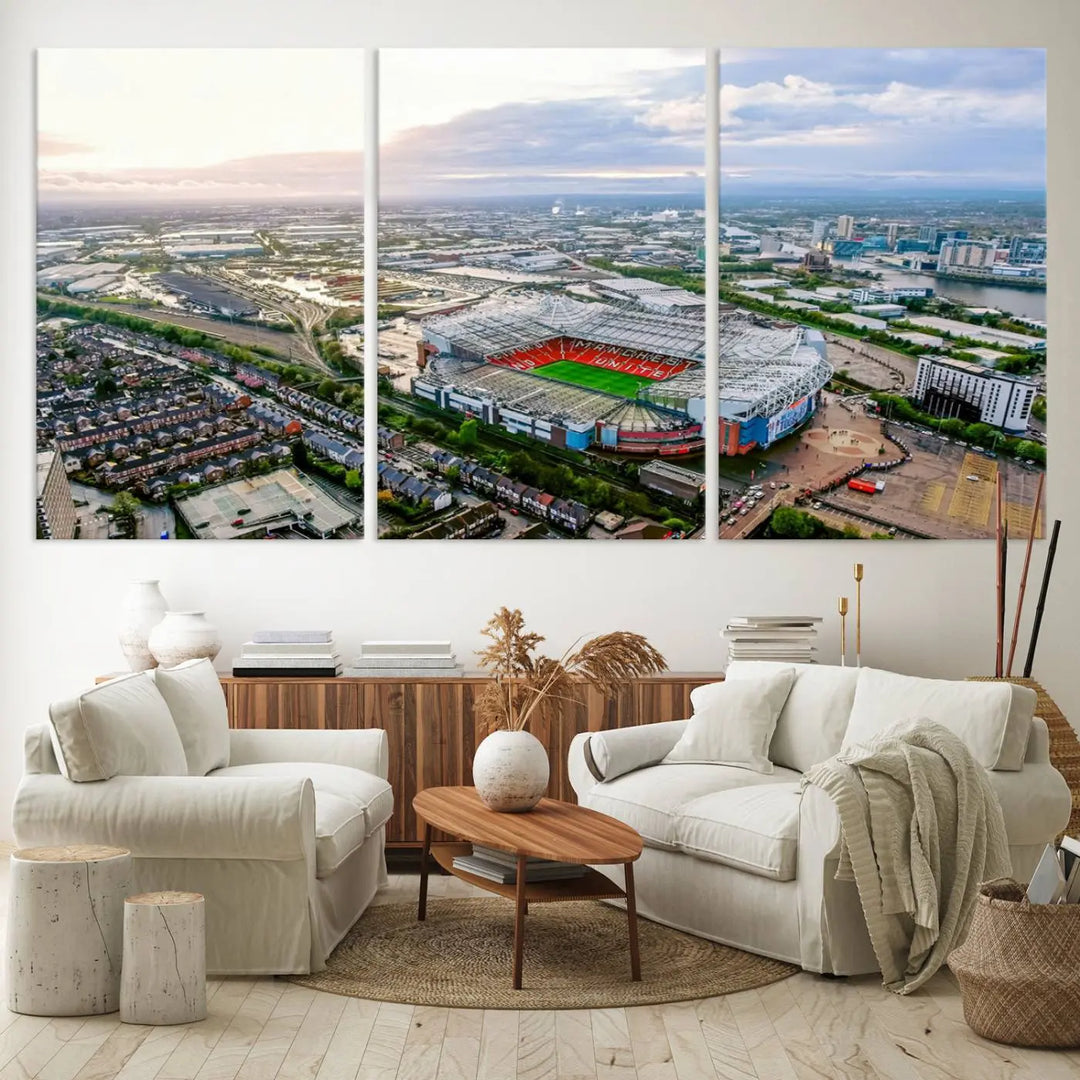 The "Old Trafford Manchester United Stadium Wall Art Canvas Print" adorns the room, showcasing an aerial view of Old Trafford at sunset. This three-panel wall art is perfect for any devoted Manchester United football fan.