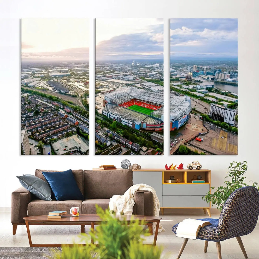 The "Old Trafford Manchester United Stadium Wall Art Canvas Print" adorns the room, showcasing an aerial view of Old Trafford at sunset. This three-panel wall art is perfect for any devoted Manchester United football fan.