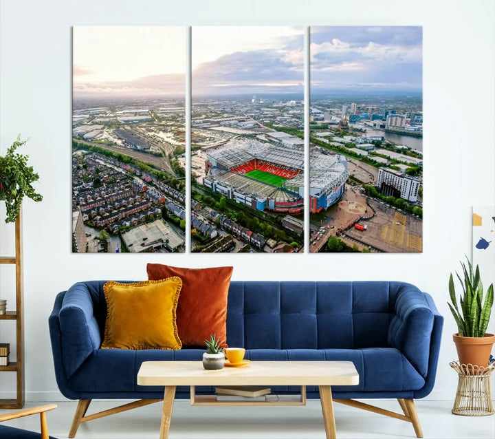 The "Old Trafford Manchester United Stadium Wall Art Canvas Print" adorns the room, showcasing an aerial view of Old Trafford at sunset. This three-panel wall art is perfect for any devoted Manchester United football fan.