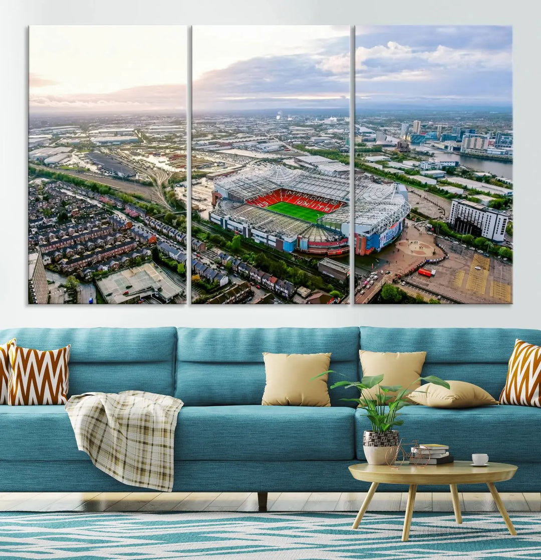 The "Old Trafford Manchester United Stadium Wall Art Canvas Print" adorns the room, showcasing an aerial view of Old Trafford at sunset. This three-panel wall art is perfect for any devoted Manchester United football fan.