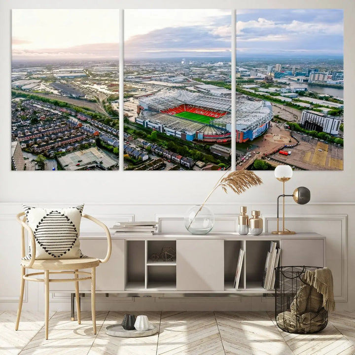 The "Old Trafford Manchester United Stadium Wall Art Canvas Print" adorns the room, showcasing an aerial view of Old Trafford at sunset. This three-panel wall art is perfect for any devoted Manchester United football fan.