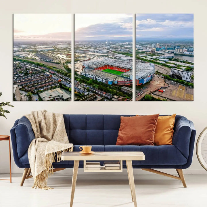 The "Old Trafford Manchester United Stadium Wall Art Canvas Print" adorns the room, showcasing an aerial view of Old Trafford at sunset. This three-panel wall art is perfect for any devoted Manchester United football fan.