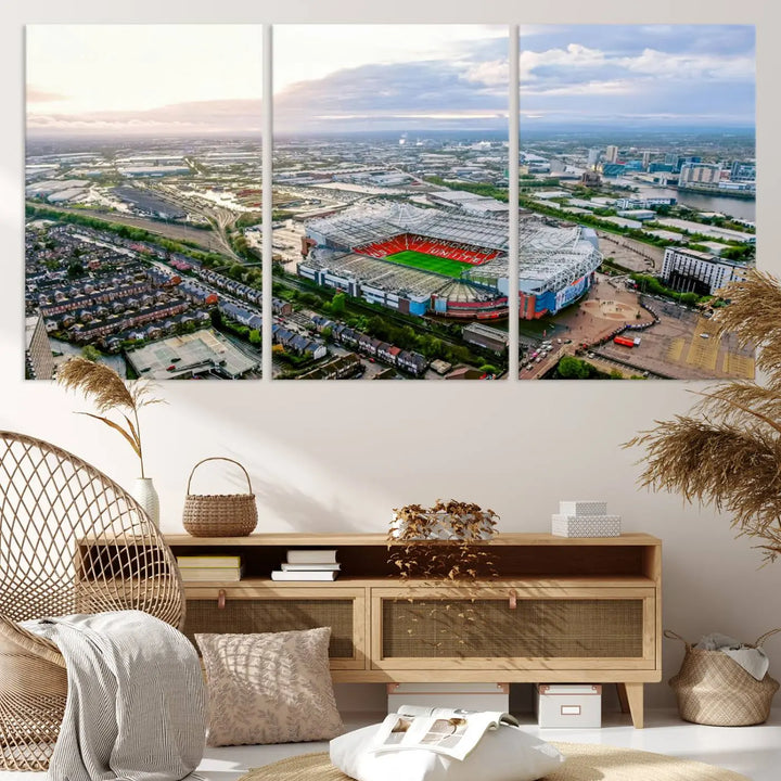 The "Old Trafford Manchester United Stadium Wall Art Canvas Print" adorns the room, showcasing an aerial view of Old Trafford at sunset. This three-panel wall art is perfect for any devoted Manchester United football fan.