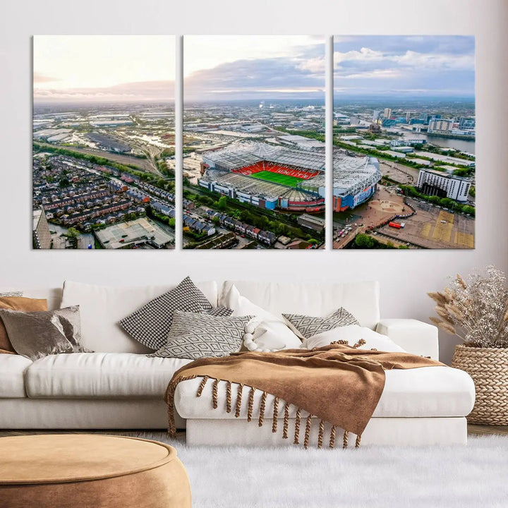 The "Old Trafford Manchester United Stadium Wall Art Canvas Print" adorns the room, showcasing an aerial view of Old Trafford at sunset. This three-panel wall art is perfect for any devoted Manchester United football fan.