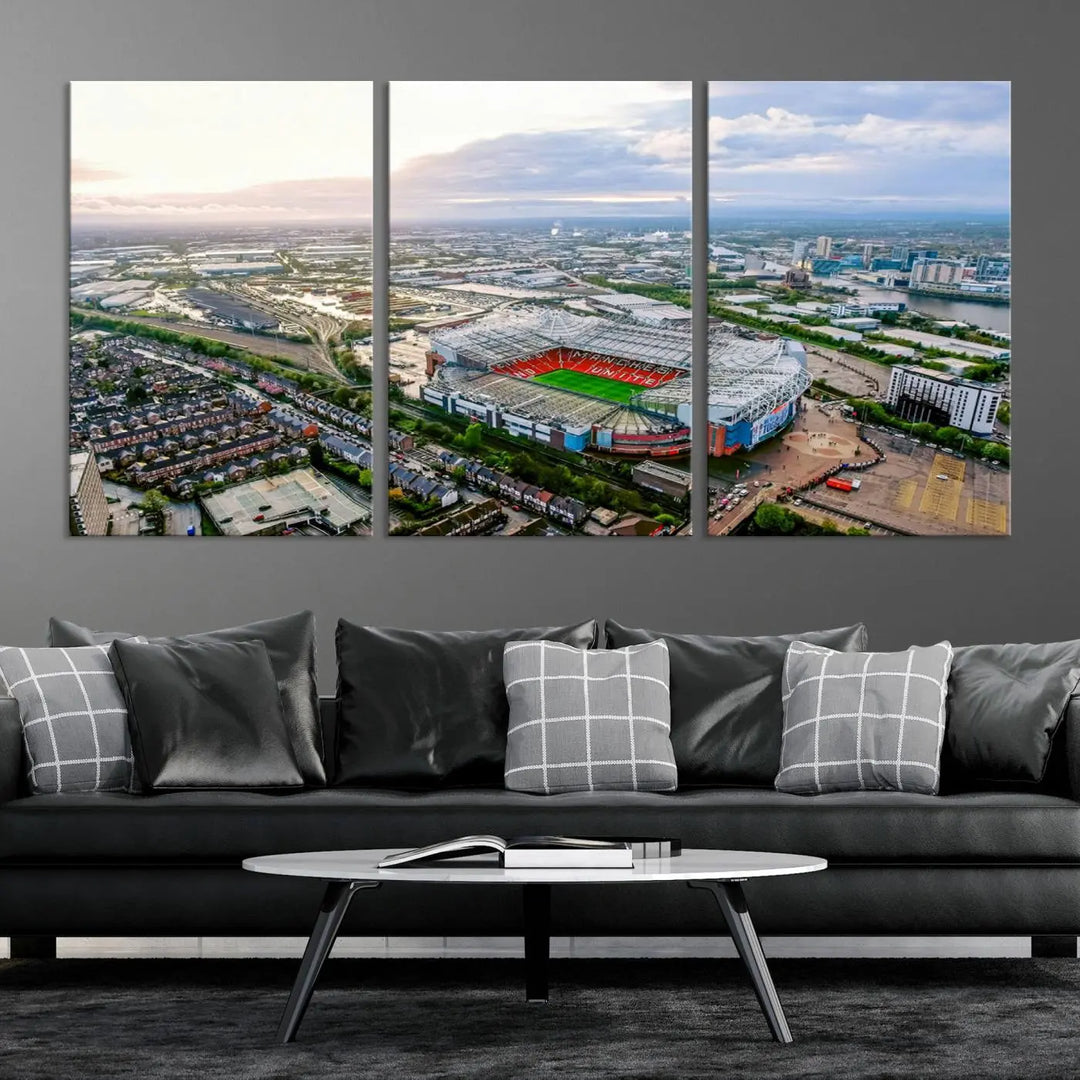 The "Old Trafford Manchester United Stadium Wall Art Canvas Print" adorns the room, showcasing an aerial view of Old Trafford at sunset. This three-panel wall art is perfect for any devoted Manchester United football fan.