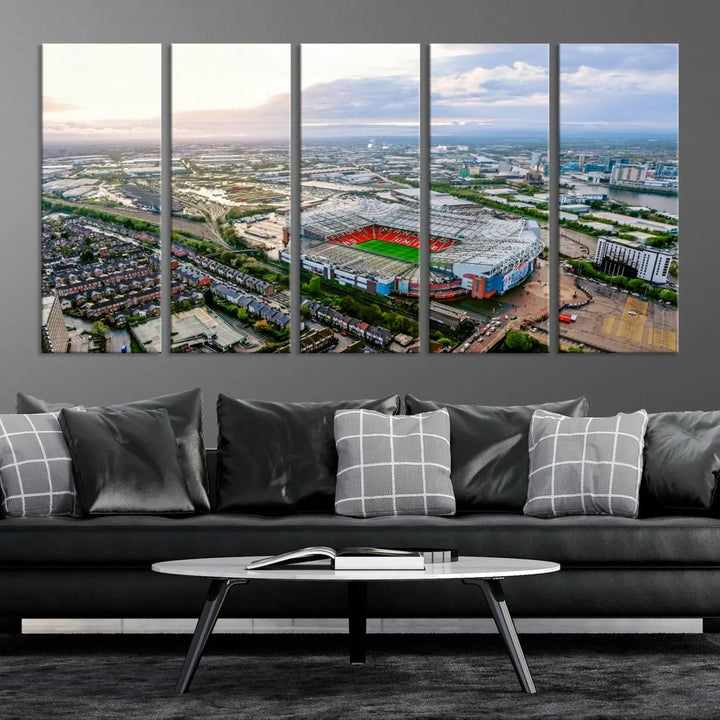 The "Old Trafford Manchester United Stadium Wall Art Canvas Print" adorns the room, showcasing an aerial view of Old Trafford at sunset. This three-panel wall art is perfect for any devoted Manchester United football fan.