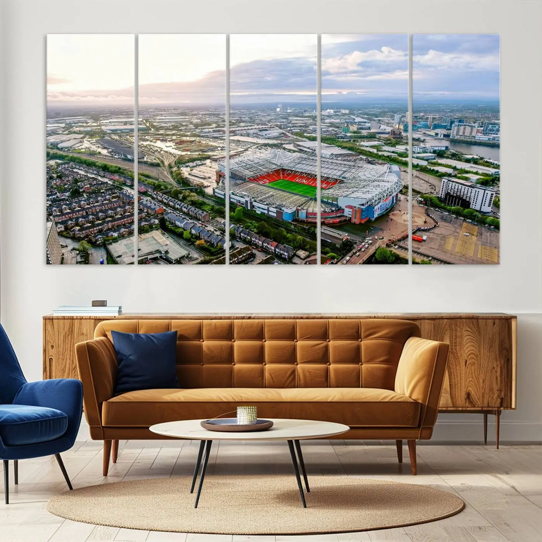 The "Old Trafford Manchester United Stadium Wall Art Canvas Print" adorns the room, showcasing an aerial view of Old Trafford at sunset. This three-panel wall art is perfect for any devoted Manchester United football fan.