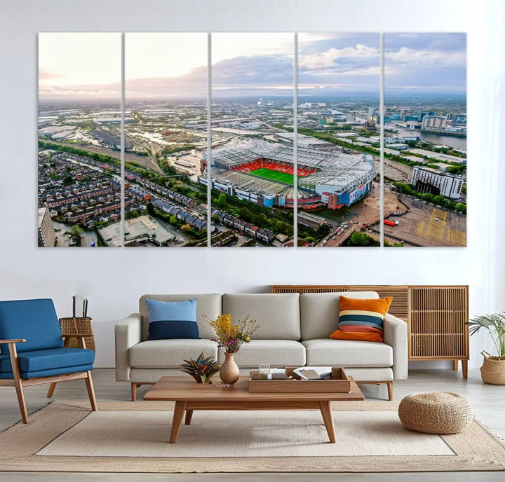 The "Old Trafford Manchester United Stadium Wall Art Canvas Print" adorns the room, showcasing an aerial view of Old Trafford at sunset. This three-panel wall art is perfect for any devoted Manchester United football fan.