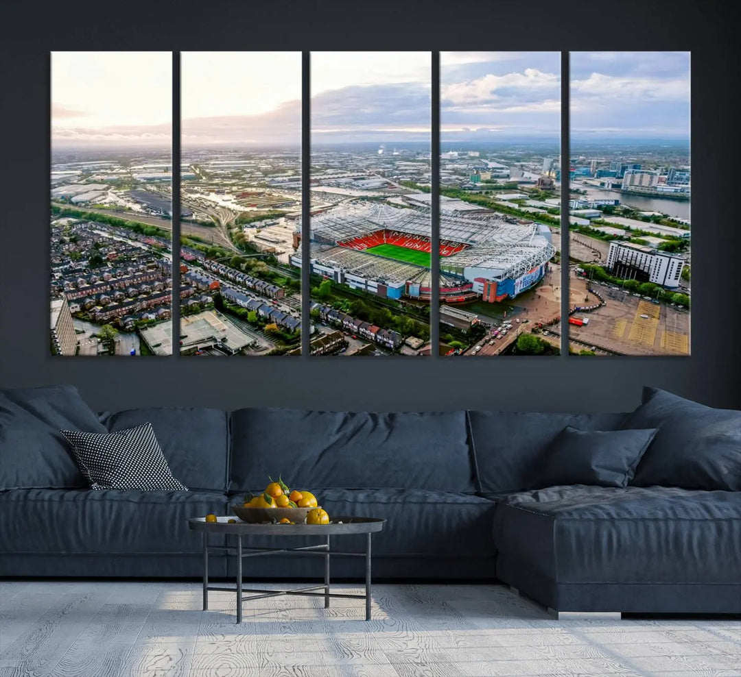 The "Old Trafford Manchester United Stadium Wall Art Canvas Print" adorns the room, showcasing an aerial view of Old Trafford at sunset. This three-panel wall art is perfect for any devoted Manchester United football fan.