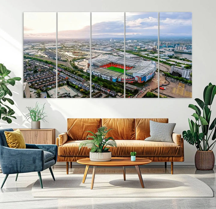 The "Old Trafford Manchester United Stadium Wall Art Canvas Print" adorns the room, showcasing an aerial view of Old Trafford at sunset. This three-panel wall art is perfect for any devoted Manchester United football fan.