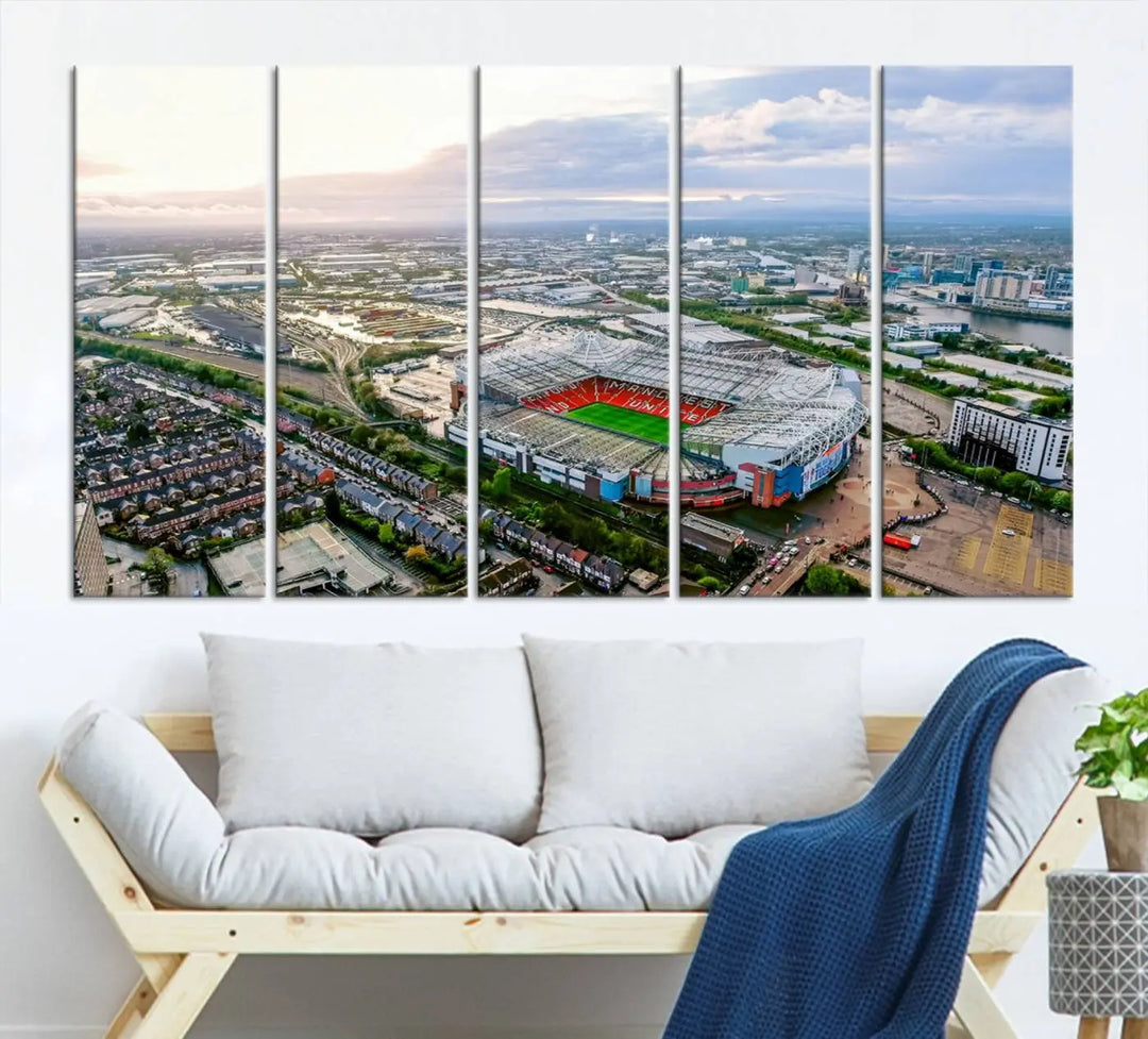 The "Old Trafford Manchester United Stadium Wall Art Canvas Print" adorns the room, showcasing an aerial view of Old Trafford at sunset. This three-panel wall art is perfect for any devoted Manchester United football fan.