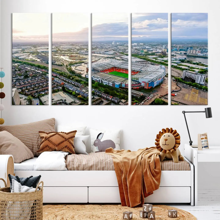 The "Old Trafford Manchester United Stadium Wall Art Canvas Print" adorns the room, showcasing an aerial view of Old Trafford at sunset. This three-panel wall art is perfect for any devoted Manchester United football fan.