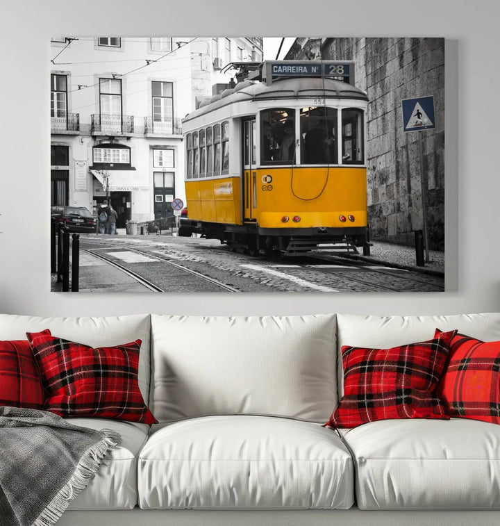 The wall art in the room features gallery-wrapped canvases with the "Old Yellow Tram Canvas Wall Art Canvas Print," which depicts a yellow tram against black-and-white city streets.