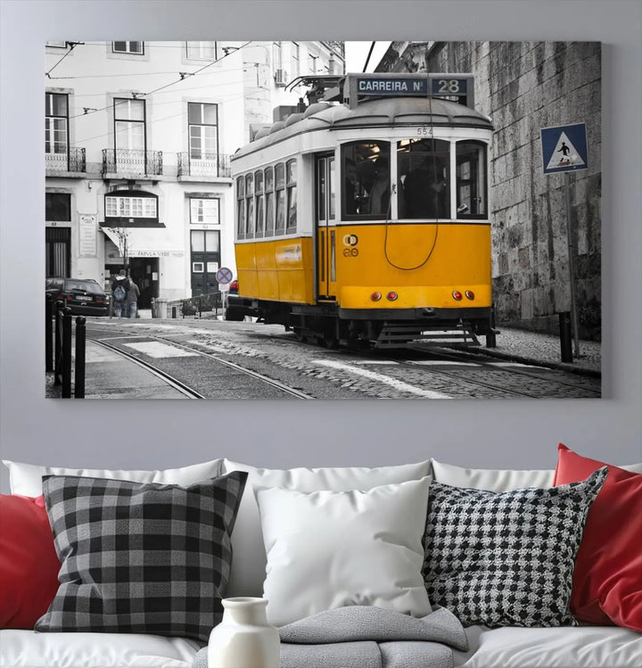 The wall art in the room features gallery-wrapped canvases with the "Old Yellow Tram Canvas Wall Art Canvas Print," which depicts a yellow tram against black-and-white city streets.