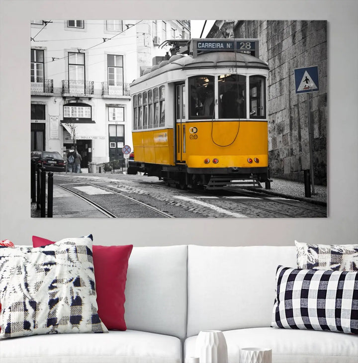 The wall art in the room features gallery-wrapped canvases with the "Old Yellow Tram Canvas Wall Art Canvas Print," which depicts a yellow tram against black-and-white city streets.