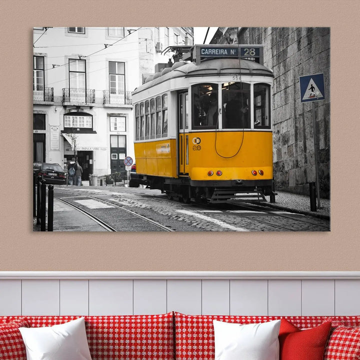 The wall art in the room features gallery-wrapped canvases with the "Old Yellow Tram Canvas Wall Art Canvas Print," which depicts a yellow tram against black-and-white city streets.