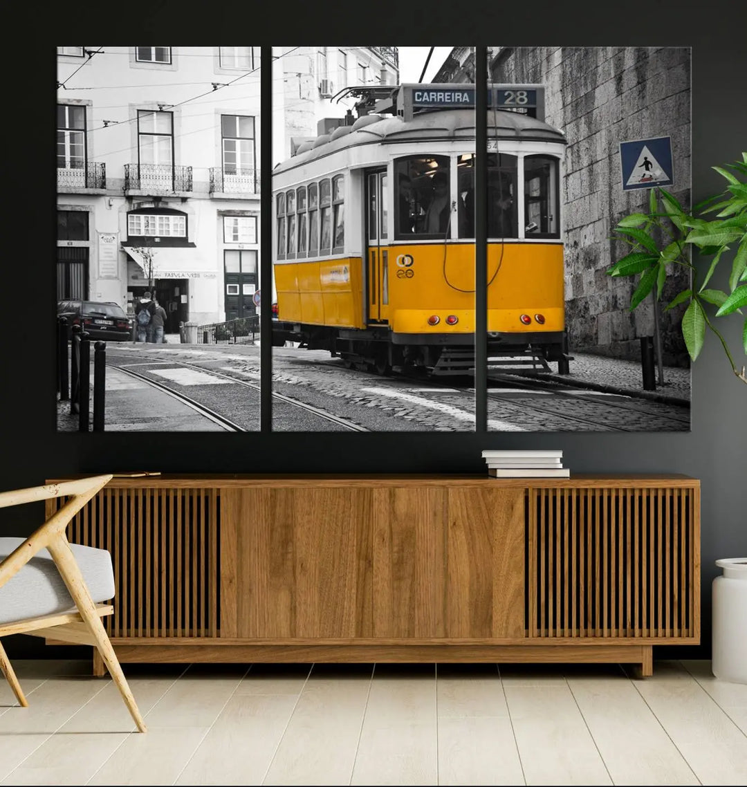 The wall art in the room features gallery-wrapped canvases with the "Old Yellow Tram Canvas Wall Art Canvas Print," which depicts a yellow tram against black-and-white city streets.