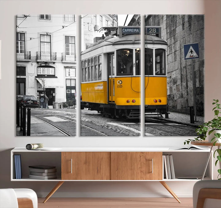 The wall art in the room features gallery-wrapped canvases with the "Old Yellow Tram Canvas Wall Art Canvas Print," which depicts a yellow tram against black-and-white city streets.