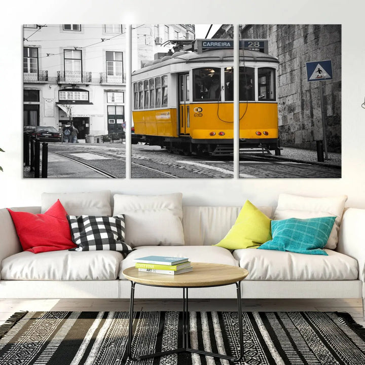 The wall art in the room features gallery-wrapped canvases with the "Old Yellow Tram Canvas Wall Art Canvas Print," which depicts a yellow tram against black-and-white city streets.