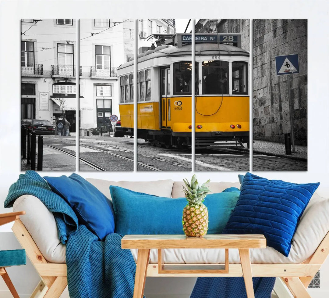 The wall art in the room features gallery-wrapped canvases with the "Old Yellow Tram Canvas Wall Art Canvas Print," which depicts a yellow tram against black-and-white city streets.