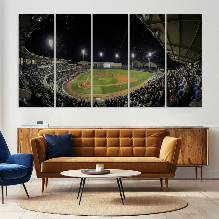 The living room is accentuated by the gallery-quality finish of a stunning three-panel canvas, the "Olsen Field at Blue Bell Park - Texas A&M Aggies Baseball Stadium Wall Art Canvas Print," beautifully depicting a baseball stadium at night.