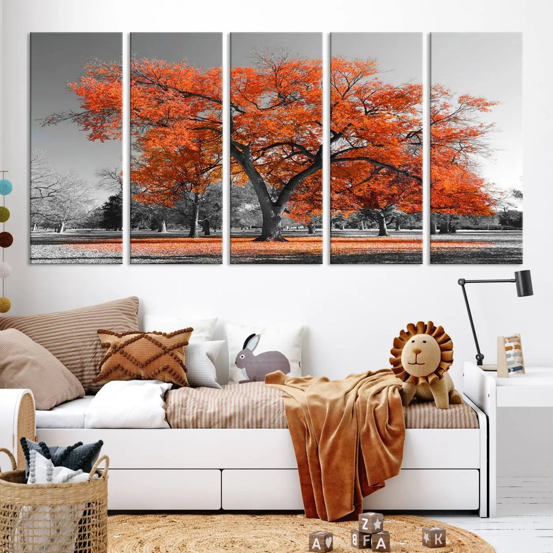 The "Orange Autumn Tree Canvas Wall Art Print" features a triptych of a tree with vibrant orange leaves set in a grayscale park. It's printed on museum-quality canvas and safeguarded by a UV-protective coating, making it the perfect artwork for any space.