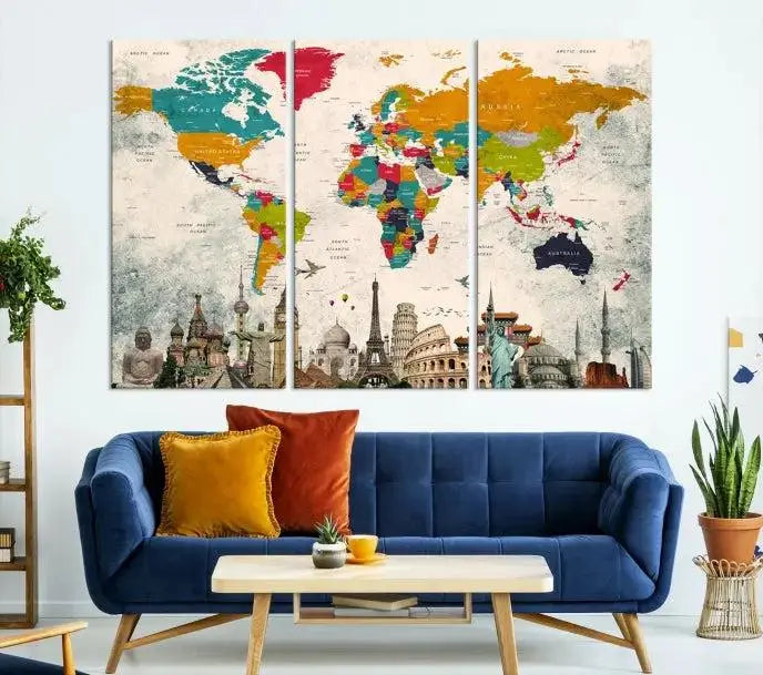 The Orange Green World Map Wall Art Canvas Print, featuring a tri-panel design with vibrant countries and renowned landmarks, is beautifully displayed.