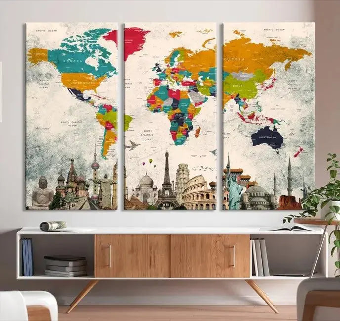 The Orange Green World Map Wall Art Canvas Print, featuring a tri-panel design with vibrant countries and renowned landmarks, is beautifully displayed.