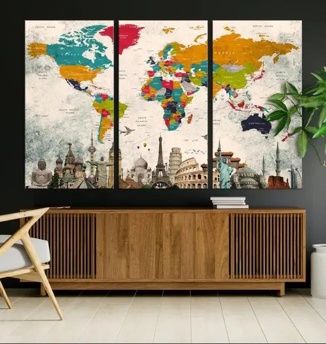 The Orange Green World Map Wall Art Canvas Print, featuring a tri-panel design with vibrant countries and renowned landmarks, is beautifully displayed.