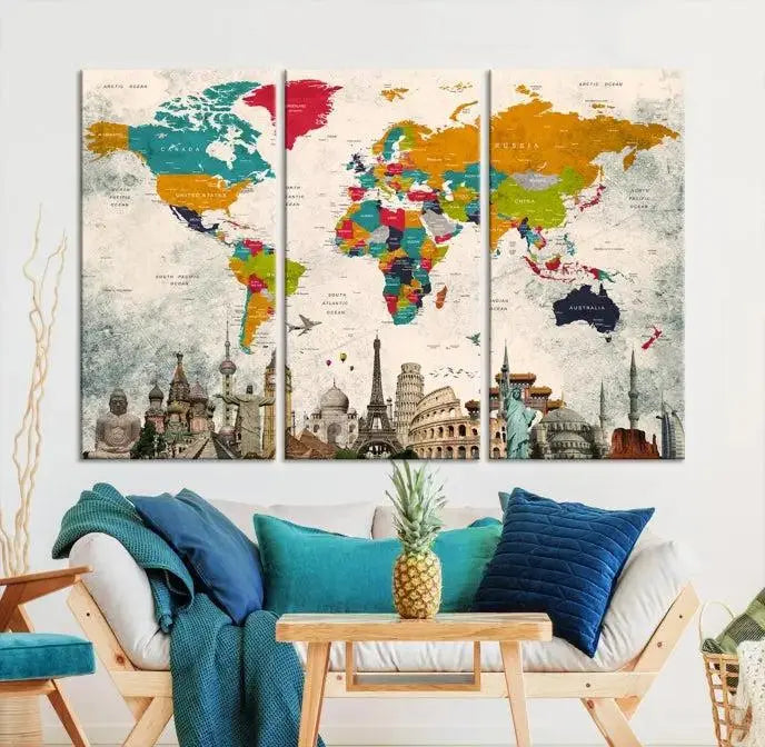 The Orange Green World Map Wall Art Canvas Print, featuring a tri-panel design with vibrant countries and renowned landmarks, is beautifully displayed.