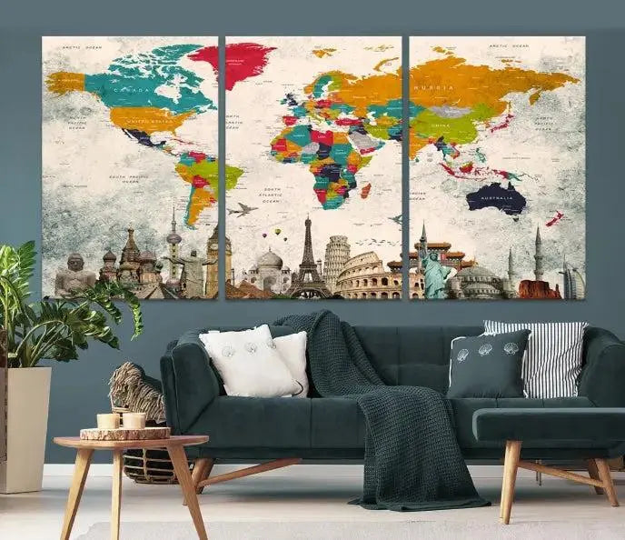 The Orange Green World Map Wall Art Canvas Print, featuring a tri-panel design with vibrant countries and renowned landmarks, is beautifully displayed.