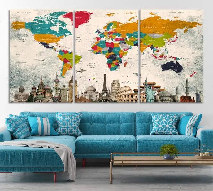 The Orange Green World Map Wall Art Canvas Print, featuring a tri-panel design with vibrant countries and renowned landmarks, is beautifully displayed.